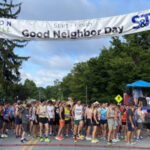 Runners gathering at the starting line at Good Neighbor Day 2023 in Downingtown, PA