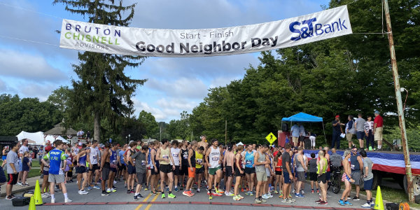 Runners gathering at the starting line at Good Neighbor Day 2023 in Downingtown, PA